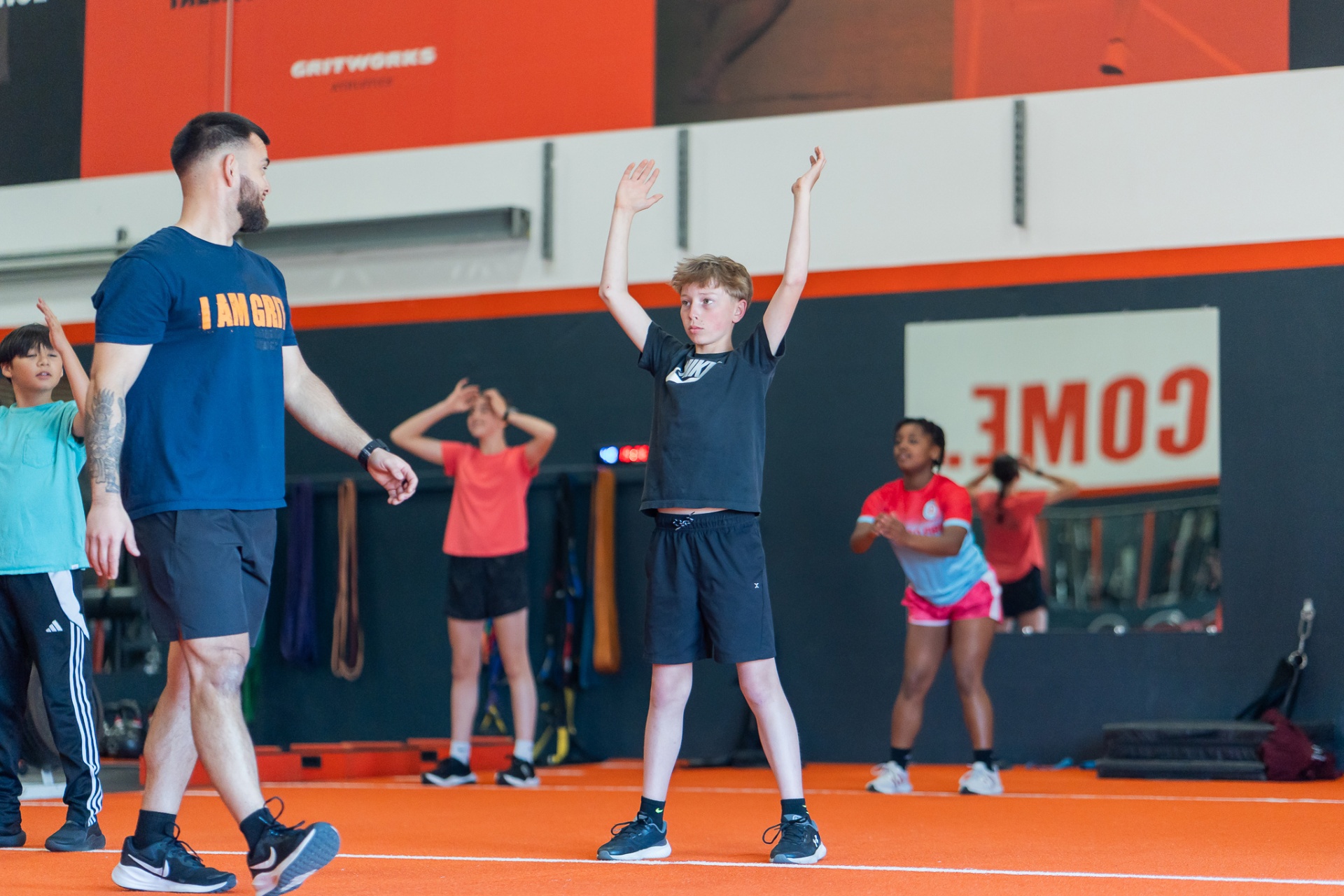 Gritworks coach leading athletes